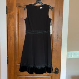 Beautiful black Calvin Klein party dress with lace trim and velvet hem
